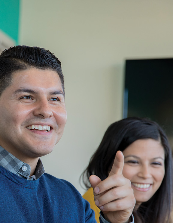 Man and women laughing