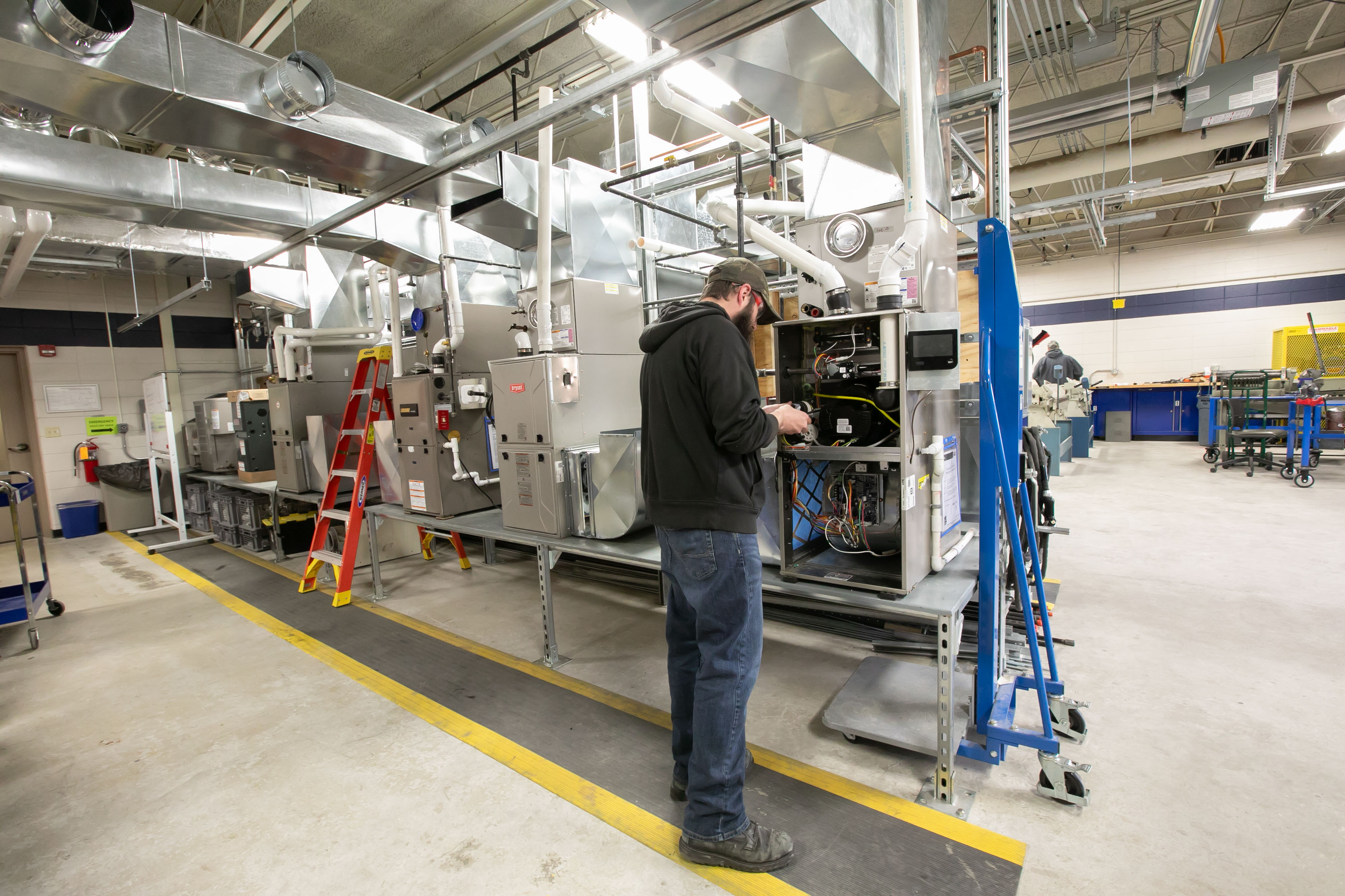 A student learns in Lakeshore College's high-tech air conditioning, ventilation and air conditioning lab..